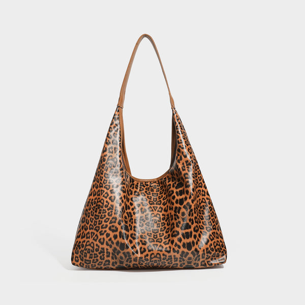 Glossy leopard-print slouchy shoulder bag with long strap and detachable tan zip pouch, detail view 7
