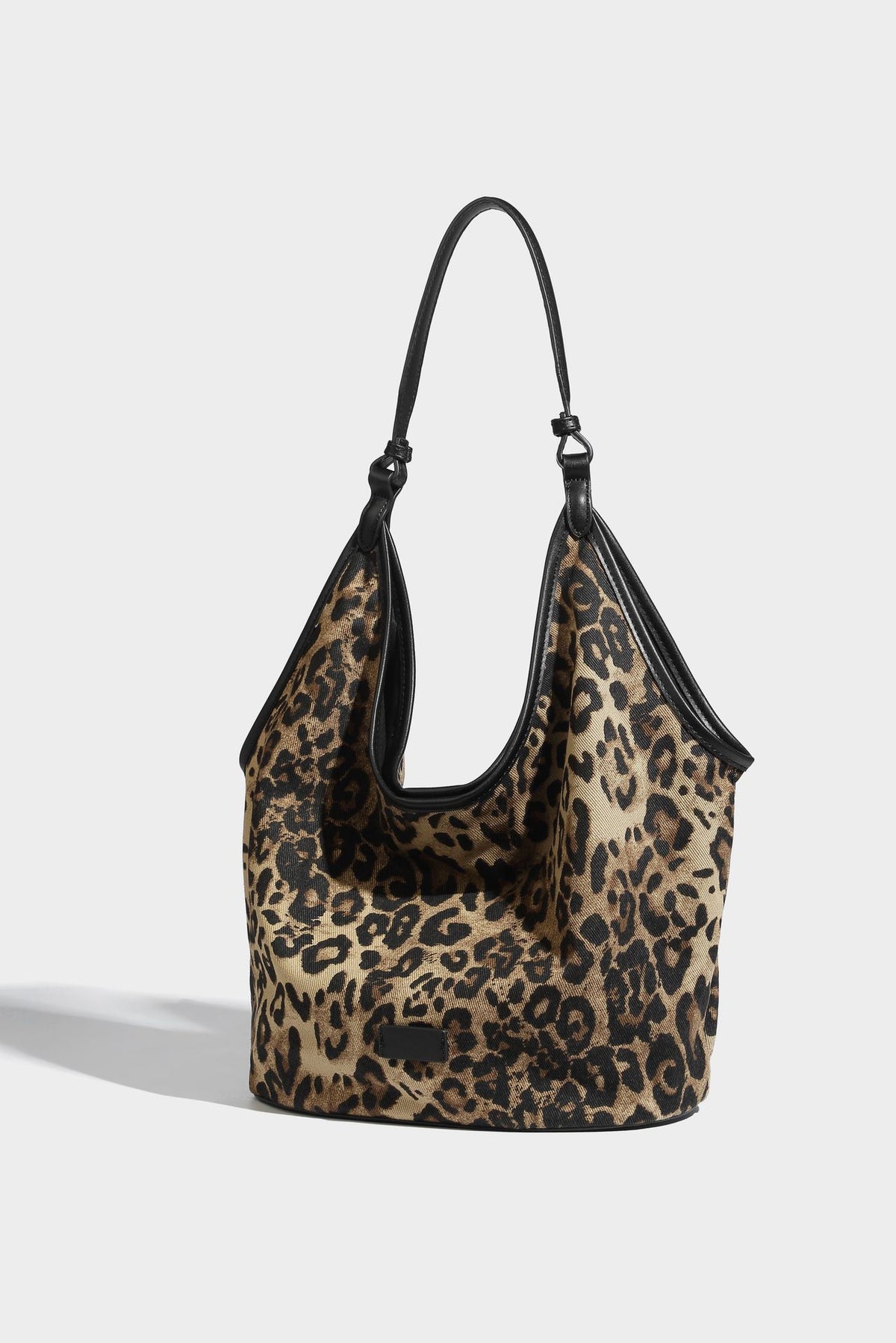 Slouchy brown leopard jacquard hobo tote bag with black leather-look trim and single shoulder strap, shown with black, detail