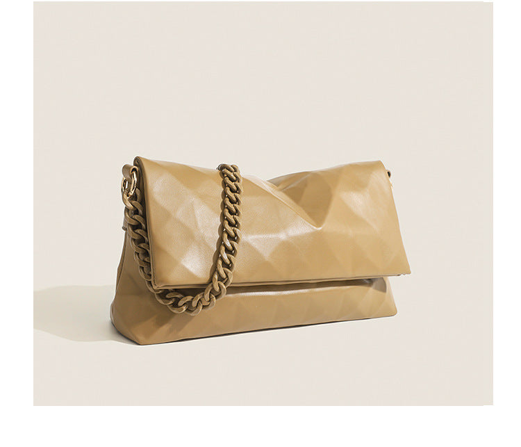 Cream white rectangular flap shoulder bag with geometric faceted surface and chunky tone-on-tone chain strap with gold-tone