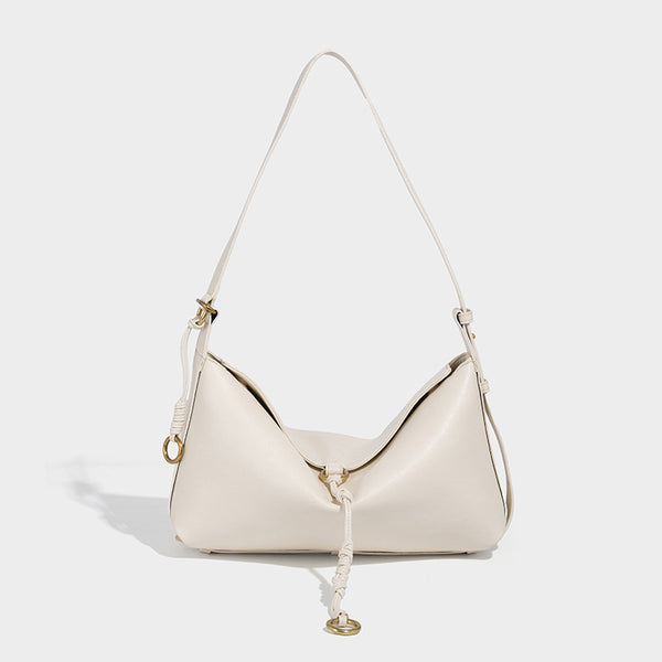 Slouchy brown leather-look shoulder bag with knotted drawcord tie closure, gold-tone ring hardware, and long adjustable