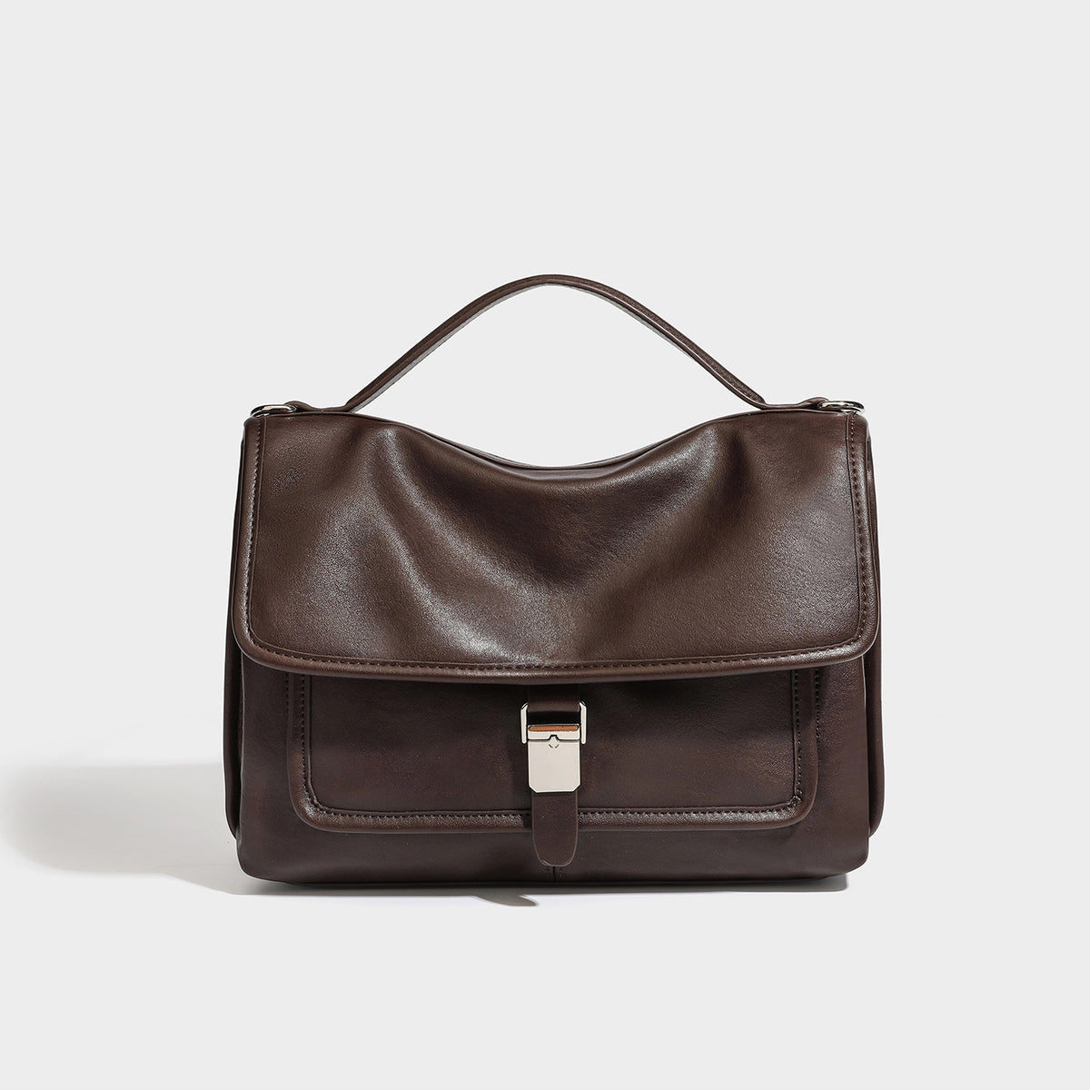 Structured rectangular flap satchel in espresso brown leather-look finish with silver-tone turn-lock buckle, top handle, and