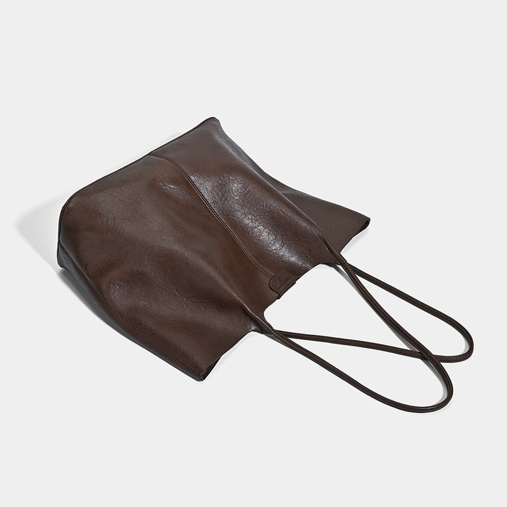 Large open-top leather-look tote bag with single shoulder strap and crinkle texture, detail view 4
