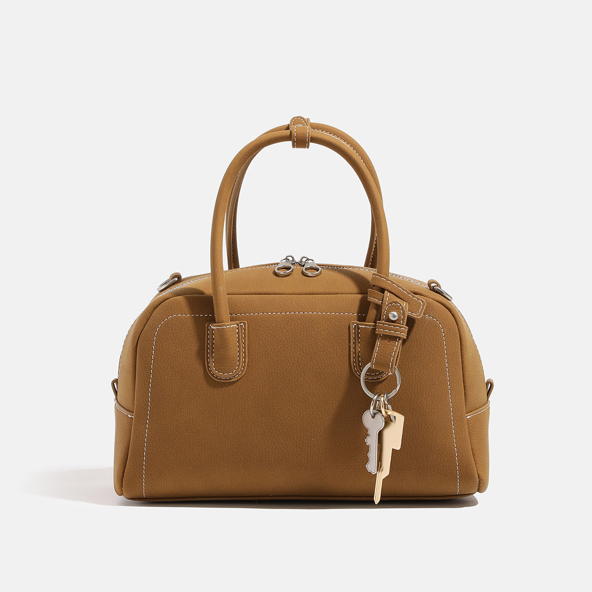 Compact retro Boston satchel bag with matte suede-look finish, twin rounded top handles, double zip closure with silver-tone