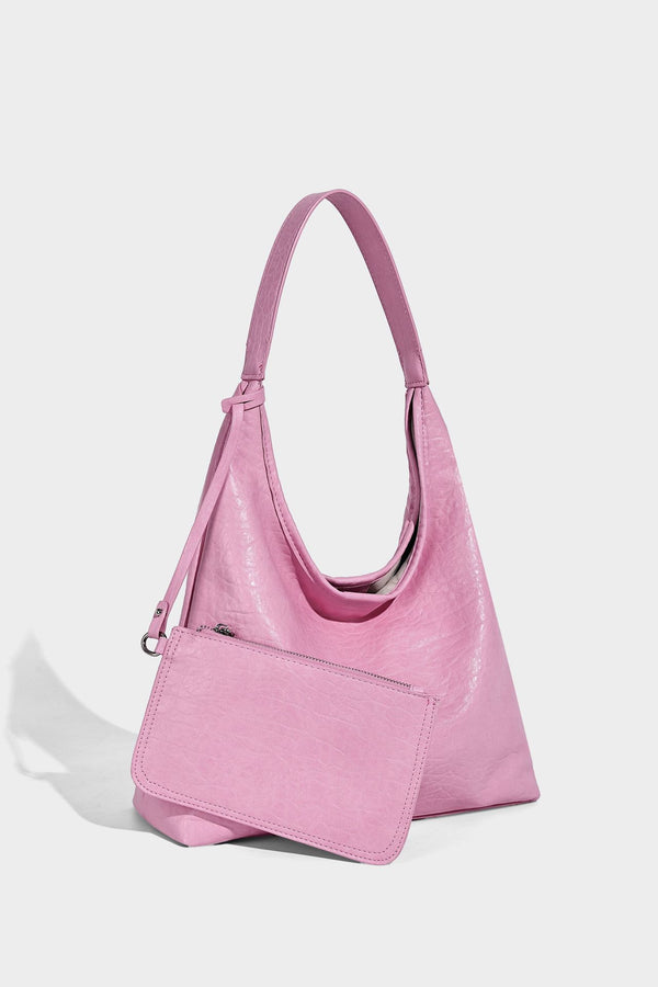 Slouchy hobo shoulder bag in pale yellow glossy pebbled leather-look finish with single shoulder strap and detachable front