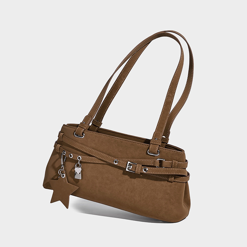 Structured trapezoid shoulder tote in dark brown matte suede-look finish with dual straps, wraparound belt bands