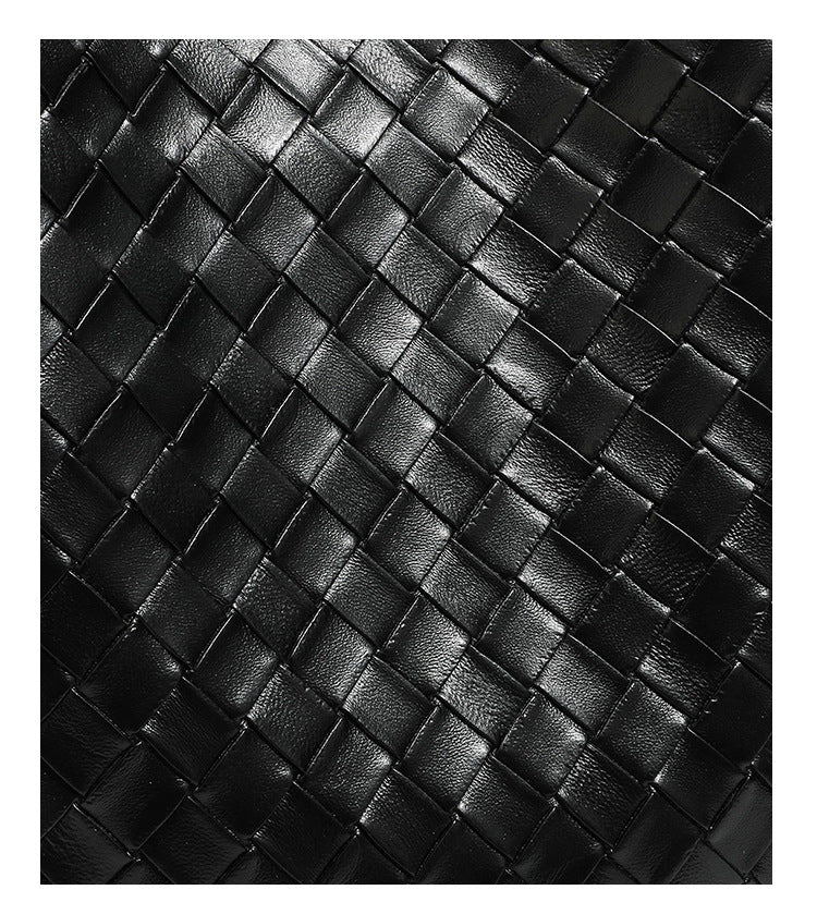 Large black bucket shoulder bag with diamond woven leather-look front panel, smooth side panels, magnetic snap closure, and