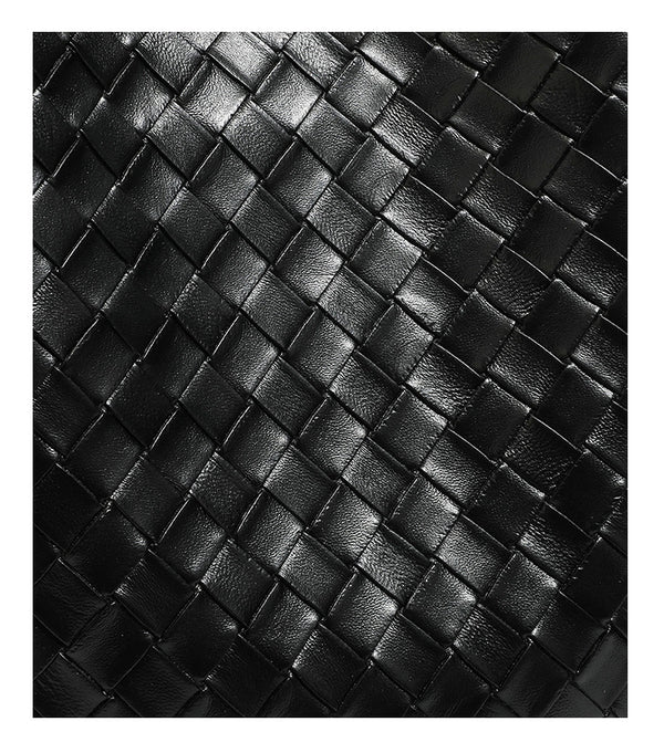 Large black bucket shoulder bag with diamond woven leather-look front panel, smooth side panels, magnetic snap closure, and