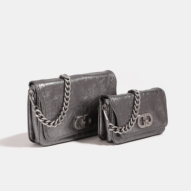 Rectangular flap shoulder bag with chunky silver-tone chain strap and crinkled leather-look finish, detail view 2