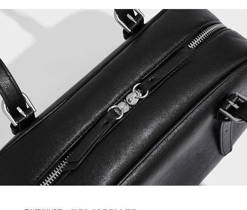Structured dome-shaped shoulder bag with leather-look finish, top zipper closure, dual adjustable slim straps, and, detail