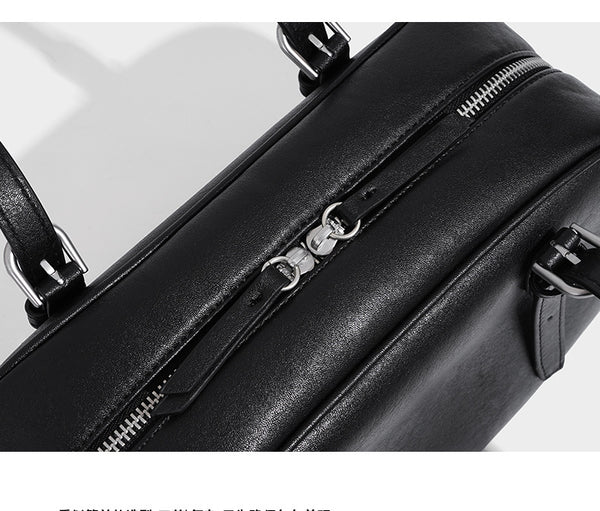 Structured dome-shaped shoulder bag with leather-look finish, top zipper closure, dual adjustable slim straps, and, detail