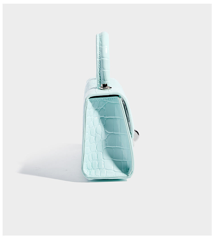 Mini croc-embossed glossy structured handbag with silver-tone turn-lock clasp and short top handle, detail view 12