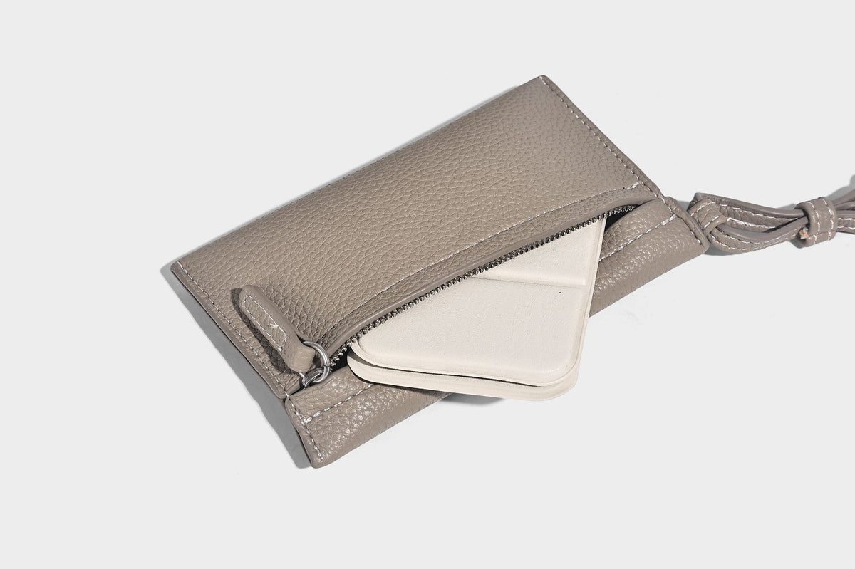Structured pebbled leather-look tote bag in taupe with long shoulder strap, detachable zip pouch, and pink tulip flower