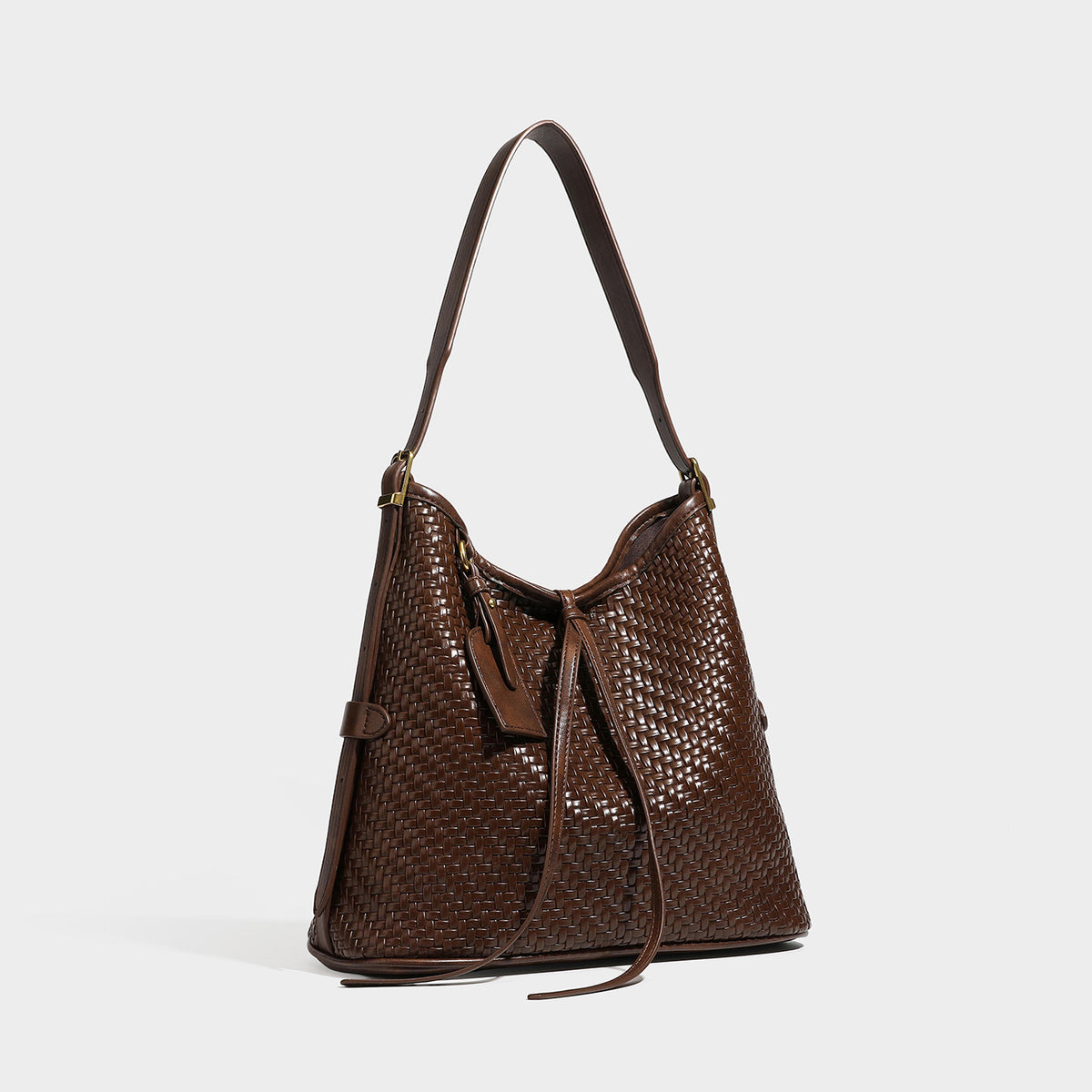 Slouchy woven leather-look shoulder bag with tie closure, gold-tone hardware, and single shoulder strap, front view