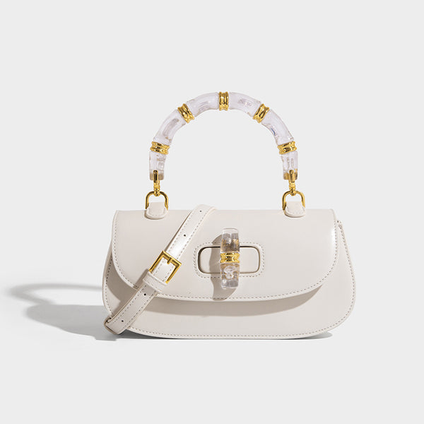 Kleine strukturierte Satteltasche mit durchscheinendem rosafarbenem Henkel aus Kunstharz im Bambus-Stil, passendem vorderem Drehverschluss, goldfarben
