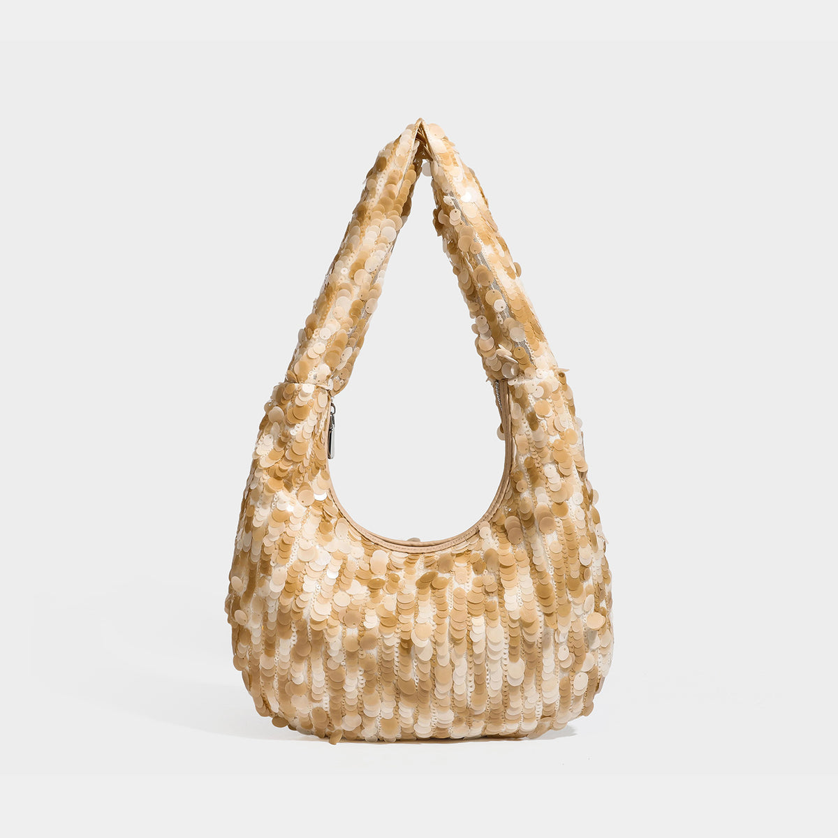 Slouchy crescent hobo shoulder bag covered in overlapping reflective sequin discs with a single integrated strap and top-zip