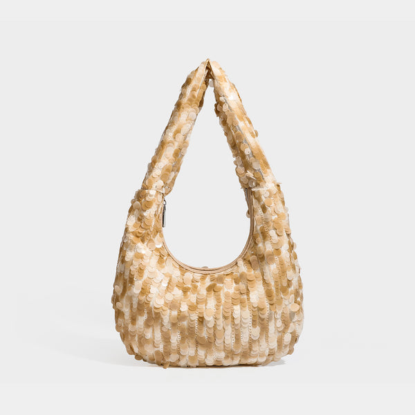 Slouchy crescent hobo shoulder bag covered in overlapping reflective sequin discs with a single integrated strap and top-zip