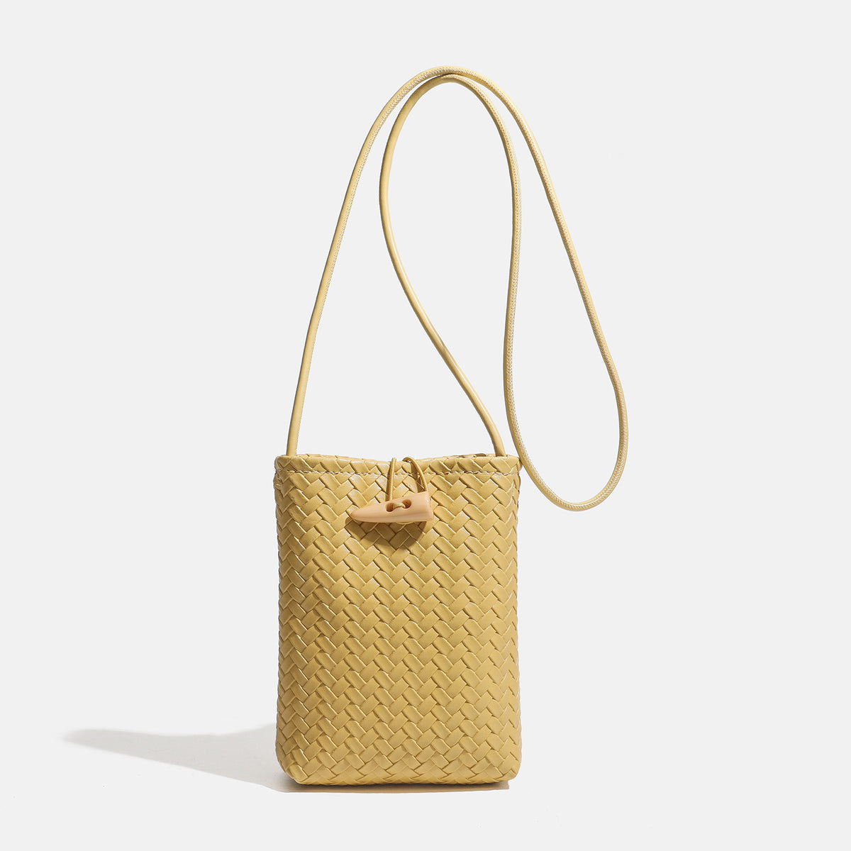 Compact woven leather-look bucket crossbody pouch with toggle closure and long fixed strap, detail view 7