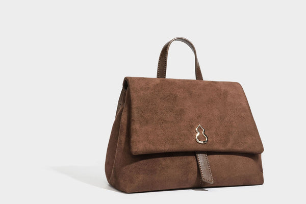 Formstabile Satchel-Tasche mit mattem Veloursleder-Finish, Überschlag, goldfarbenen Emblem-Beschlägen, kurzem Tragegriff und verstellbarem Crossbody-Riemen