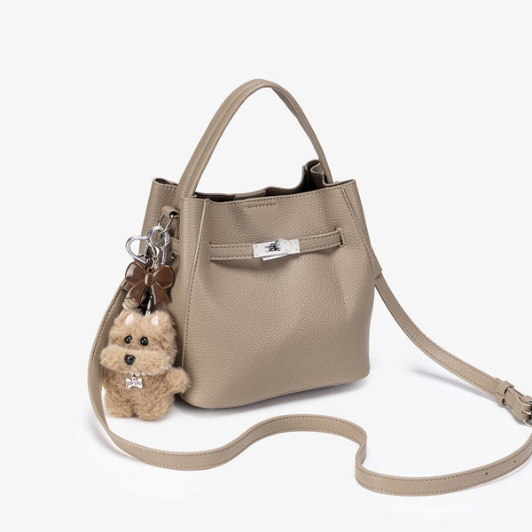 Compact structured bucket bag in pebbled leather-look finish with silver turn-lock front clasp, dual top handles, detachable