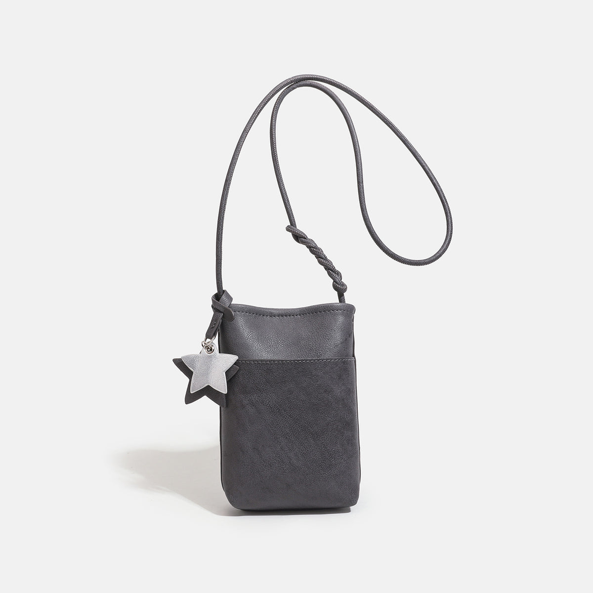 Small vertical textured mini crossbody phone bag with long braided cord strap and silver-toned star charm, detail view 8