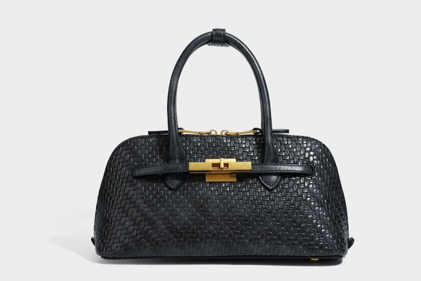 Structured woven-embossed leather-look satchel with dual rolled top handles, gold-tone turn-lock closure, and detachable