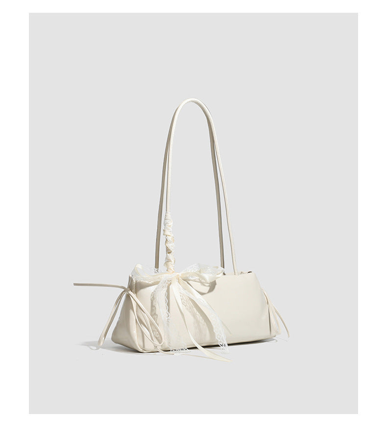 Compact glossy leather-look shoulder bag with lace bow and ribbon trim, detail view 19