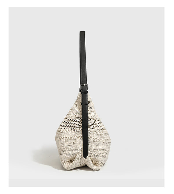Cream woven rope-cord hobo bag with black adjustable leather-look strap and matching cream drawstring pouch, detail view 9