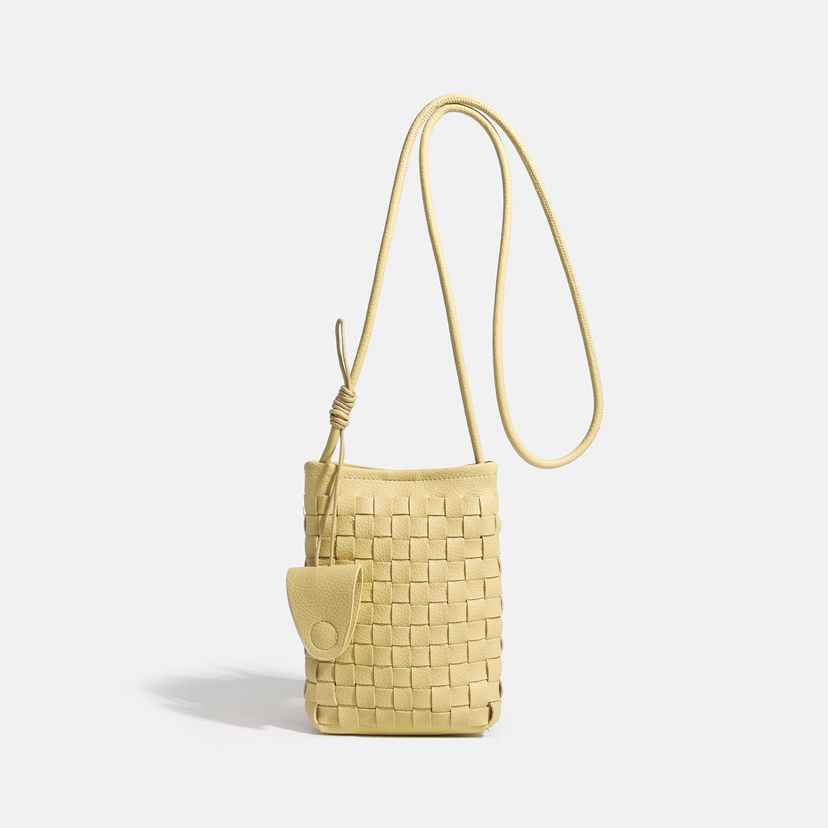 Mini woven square-pattern crossbody phone bag with long cord strap and front snap flap pocket in red textured leather-look