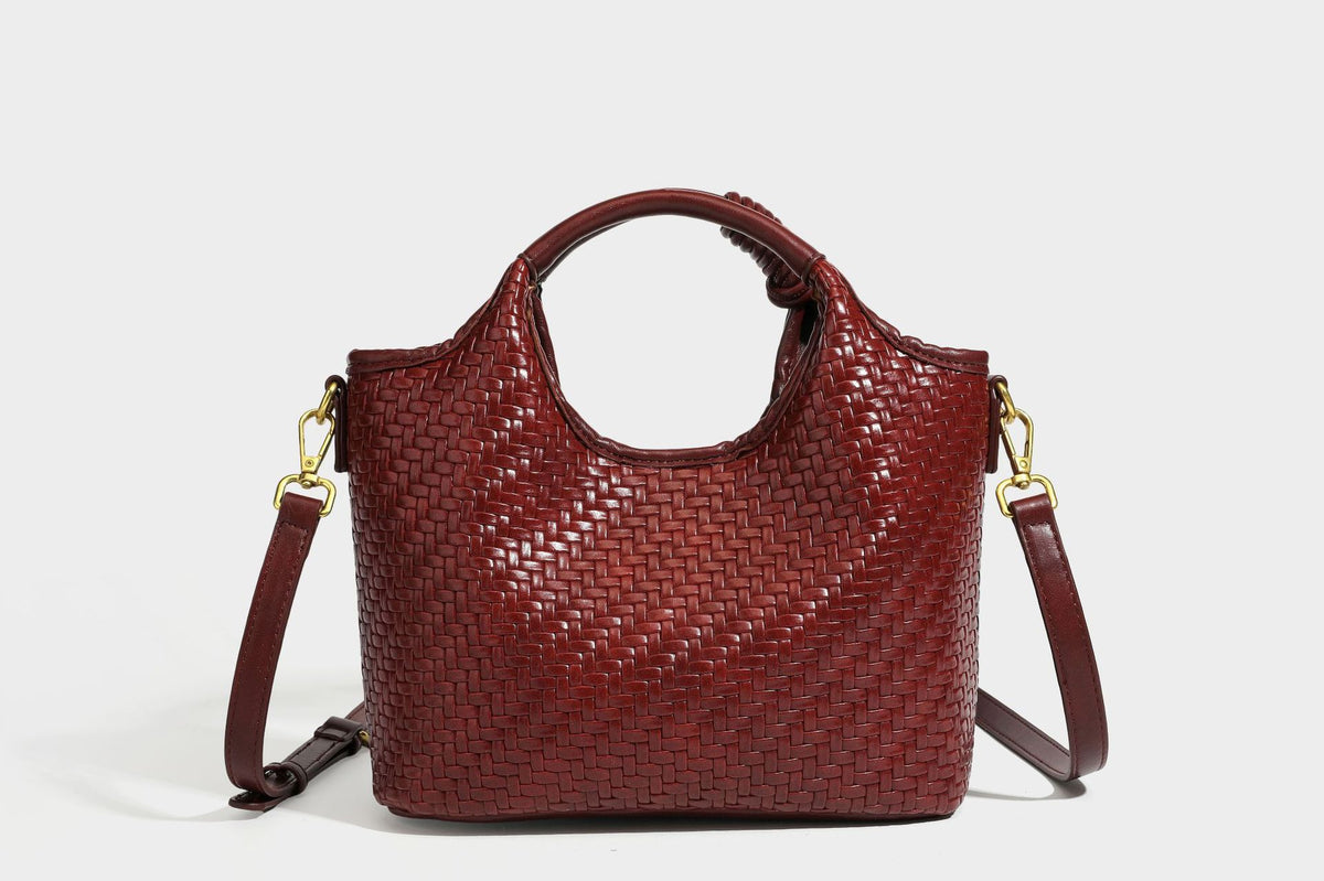 Woven leather-look tote bag in mocha brown with knotted top handle, front flap pocket, and detachable crossbody strap with