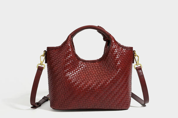 Woven leather-look tote bag in mocha brown with knotted top handle, front flap pocket, and detachable crossbody strap with