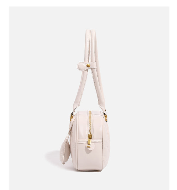 Small structured quilted leather-look zip shoulder bag with gold-tone hardware and adjustable strap, detail view 17