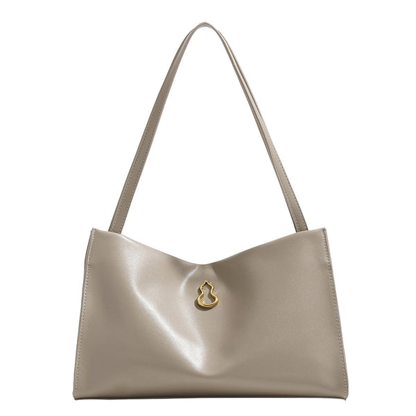 Smooth leather-look slouchy trapezoid shoulder tote with gold-tone gourd clasp hardware and long slim straps, detail view 5
