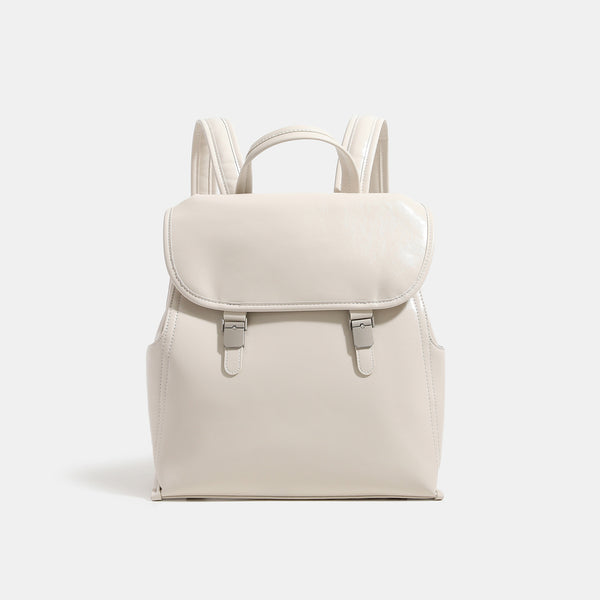 Structured glossy leather-look flap backpack with twin buckle closures and top grab handle, detail view 9