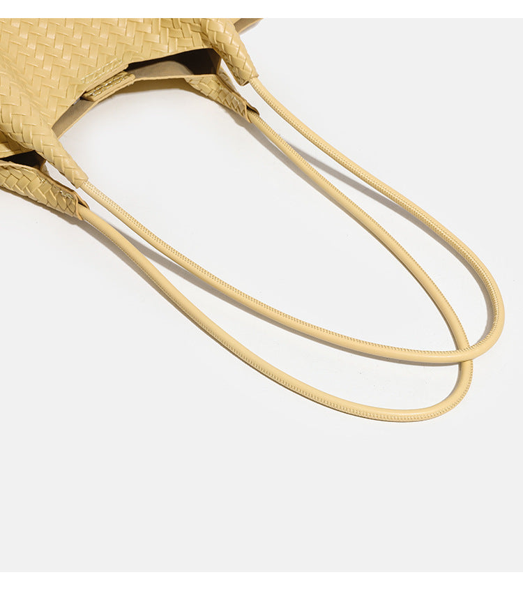 Large woven textured tote bag with long shoulder straps and structured rectangular base, detail view 13