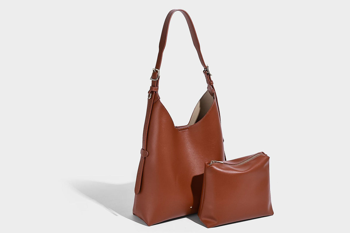Large open-top hobo shoulder bag in tan leather-look finish with detachable zip pouch and adjustable buckle strap, detail