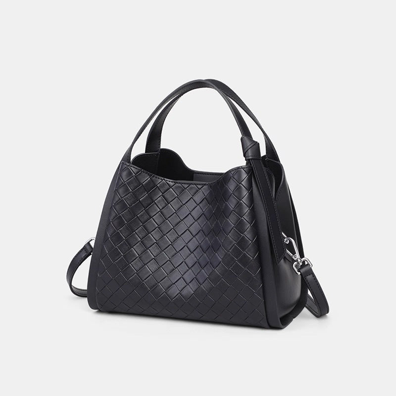 Black woven leather-look bucket tote bag with dual top handles and detachable shoulder strap, silver-tone hardware and zip
