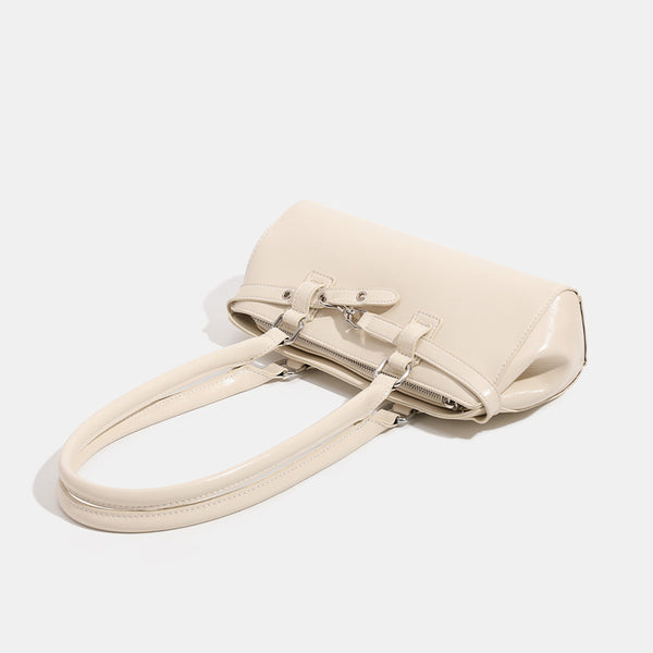 Glossy leather-look baguette shoulder bag with silver-tone hardware and buckle-strap detail, detail view 4