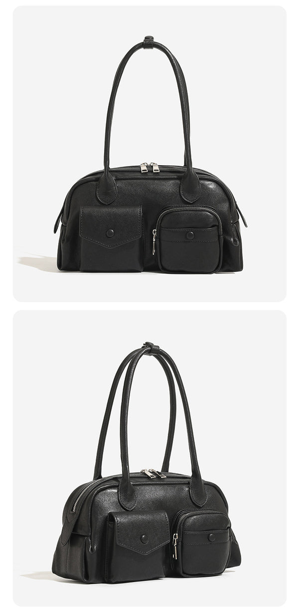Structured retro bowling-style top-handle handbag with dual zip closure, front snap-flap pocket, and front zip pocket, detail