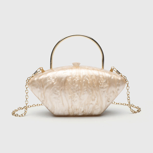 Shell-shaped pearlescent top-handle clutch bag with arched gold-tone metal handle and gold chain strap, detail view 10