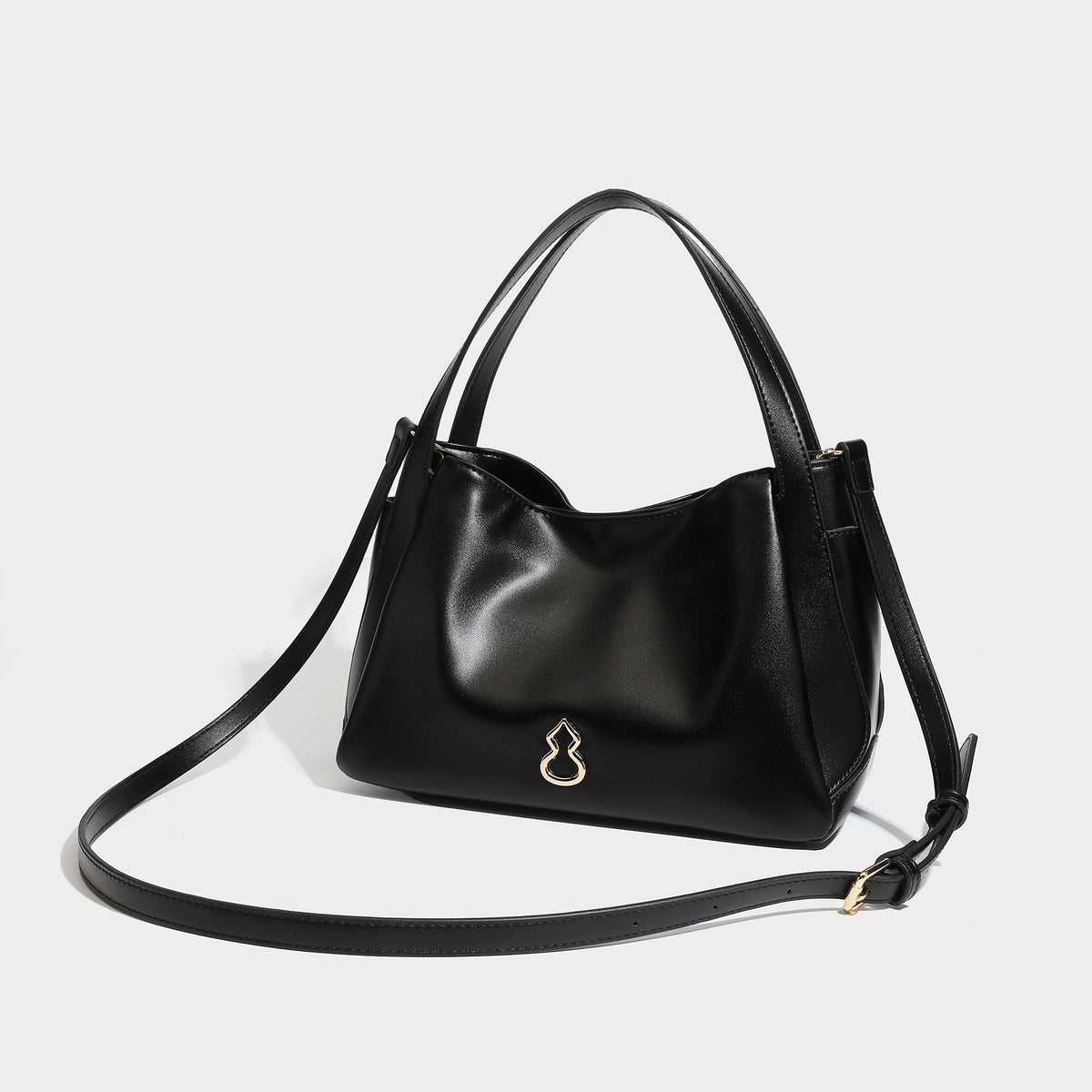 Structured glossy leather-look tote shoulder bag with dual top handles, detachable crossbody strap, side pockets, and, detail