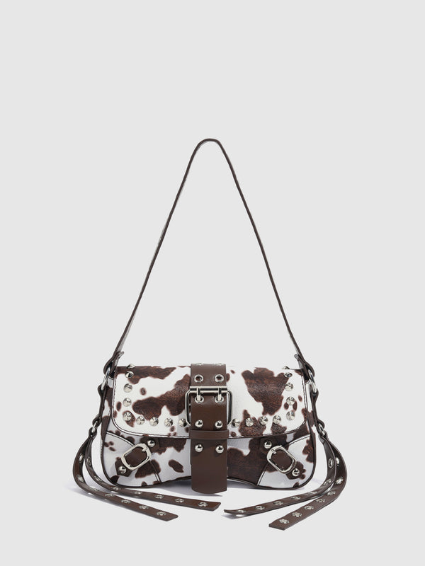 Mini square cow-print leather-look shoulder bag with metal stud hardware and dual carry straps, detail view 6