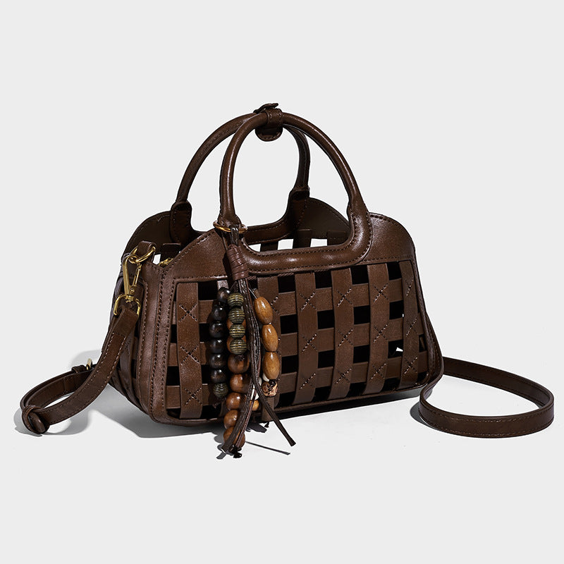 Small structured woven lattice top-handle satchel bag with bead-and-tassel charm and gold-tone hardware, detail view 7