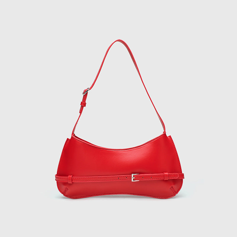 Curved baguette shoulder bag with front buckle strap and adjustable thin strap in glossy leather-look finish, detail view 3