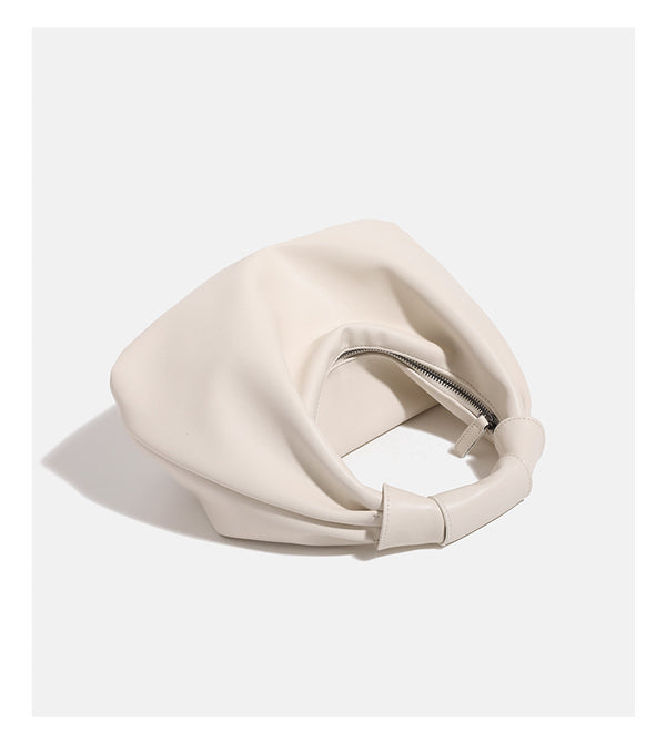Slouchy leather-look hobo bag with knotted loop handle and top zipper closure, detail view 15