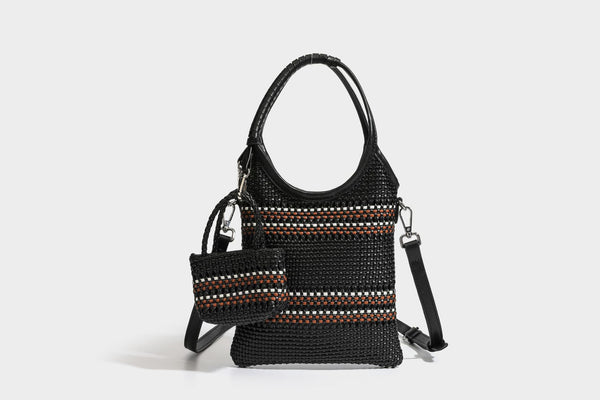 Color-block woven tote bag with rounded leather-look handles, detachable crossbody strap, and matching mini clip-on pouch in