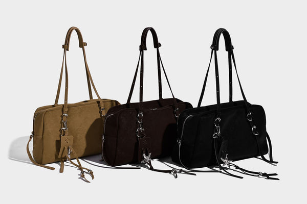 Structured rectangular matte suede-like shoulder bag with silver-tone hardware, zip closure, double top handles, and, detail