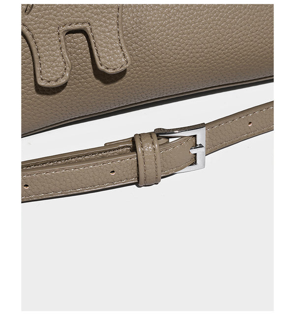 Compact pebbled bucket tote bag with elephant charm, twin top handles, and detachable crossbody strap, detail view 12