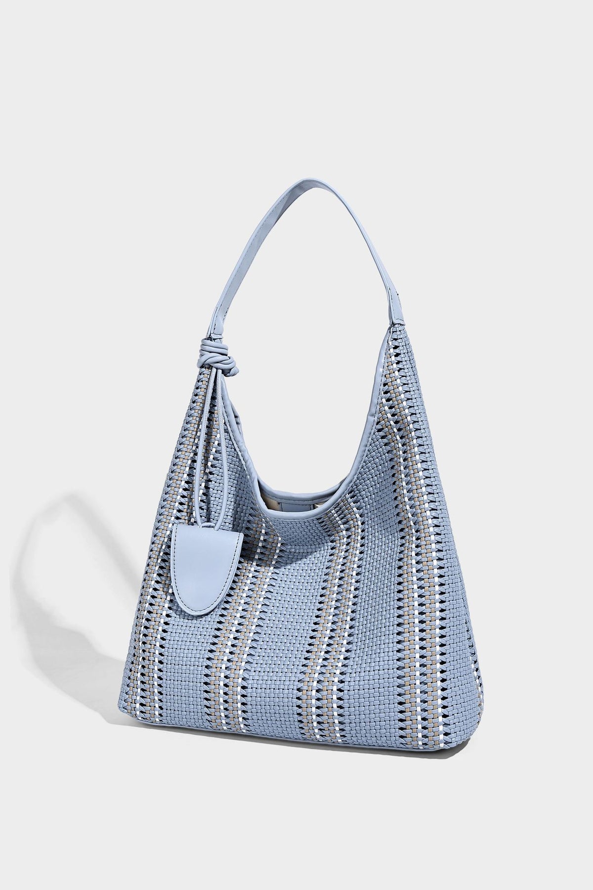 Woven striped slouch shoulder tote bag with knotted strap and attached front flap pouch, detail view 17
