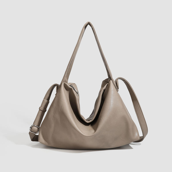 Slouchy leather-look hobo shoulder bag with top zipper and silver-tone hardware, front view