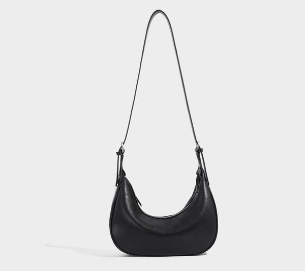 Crescent half-moon shoulder bag in pebbled leather-look finish with adjustable strap and silver-tone hardware, detail view 26